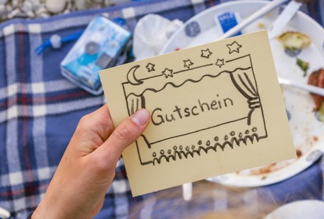 Hand holding card saying coupon