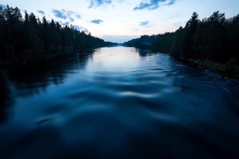 River in summer at midnight