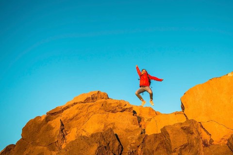 Young woman jumping in the air