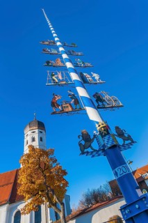 Catholic parish church St. Vitus with maypole in Erling