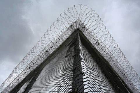 Security fence with barbed wire