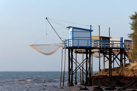 Traditional fishing huts built on stilts on the Gironde