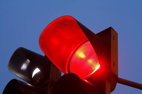 Red traffic lights at dusk