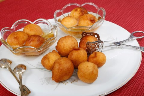 Swabian dessert on plate with pastry tongs