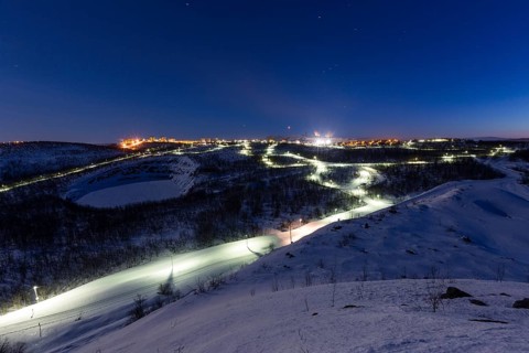 Lit cross-country ski trail at night