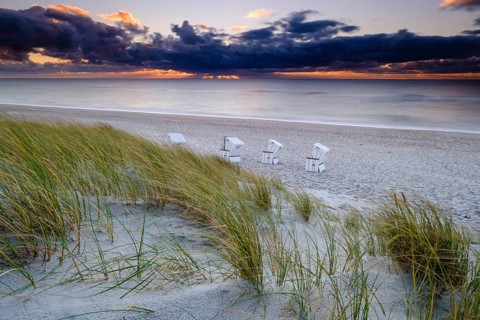 Beach chairs at the west beach of Hornum in the evening light