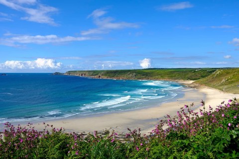Wide sandy beach with waves