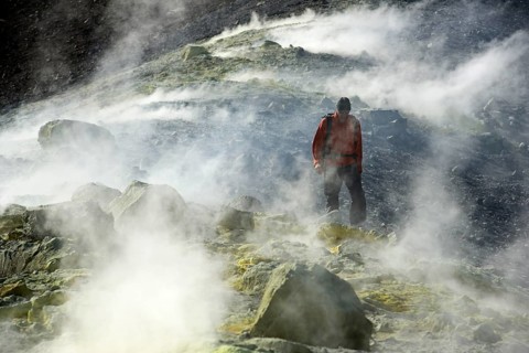 Hiker on the Gran Cratere walks through sulphur fumaroles