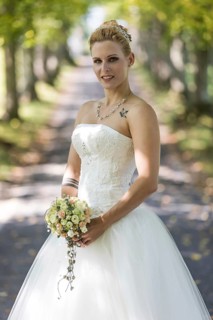 Young blonde woman in a white wedding dress