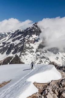 Ski tourer ascending the Hochweisse near Pfossental in Schnals