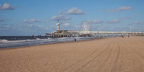 Pier with bungee jumping tower and Ferris wheel