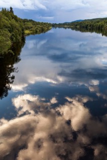 Reflection of clouds in river Klaralven