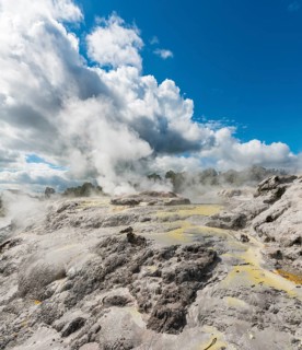 Steaming Pohutu Geyser and Prince of Wales Feathers Geyser