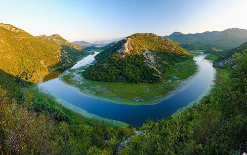 River bend of the river Rijeka Crnojevica in the evening light
