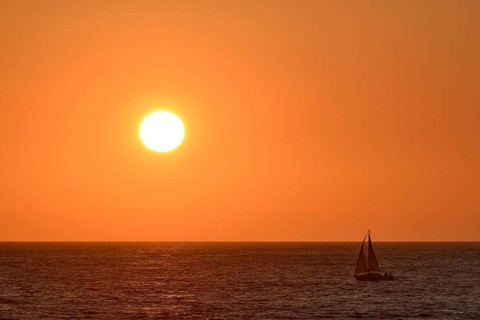 Sailboat at sunset over the North Sea