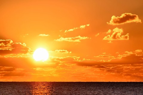 Sunset with cloudy sky above the North Sea