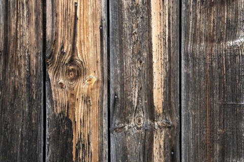 Old weathered wooden boards on wooden wall