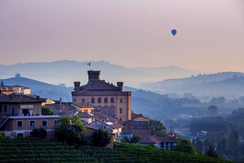 Hot-air balloon at sunrise over Barolo