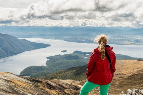Female hiker looking at the South Fiord of Lake Te Anau