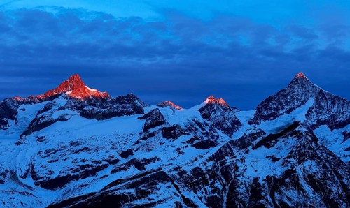 Zinalrothorn with snow in red dawn glow