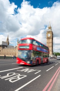 Red double-decker bus on the Westminster Bridge