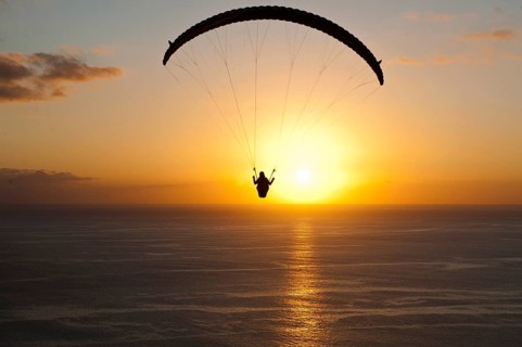 Paraglider at sunset over the Atlantic