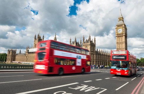 Two red double-decker buses on the Westminster Bridge