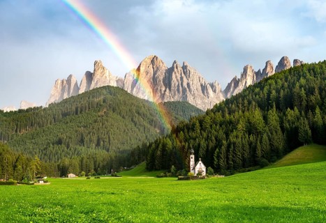 Rainbow in front of the church St. Johann in Ranui