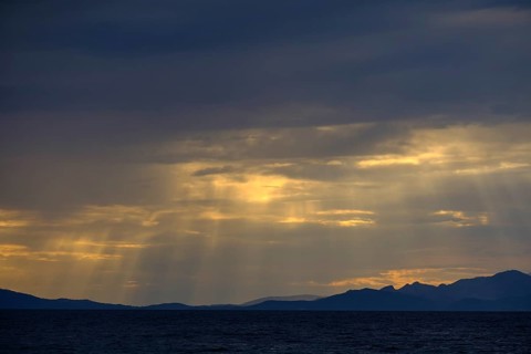 Thunderclouds at sunset on the beach