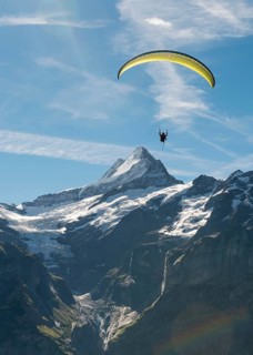 Paraglider flying in the sky