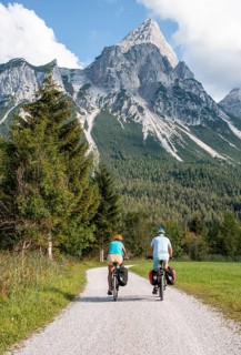 Cyclist with mountain bikes
