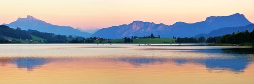 Lake Irrsee at dusk with Salzkammergut and the Dachstein Mountains