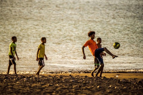 Teenager playing soccer