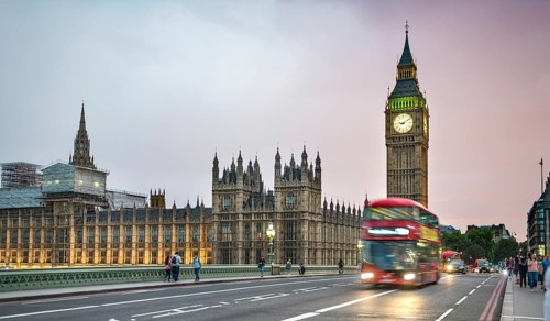 Red double-decker bus on the Westminster Bridge