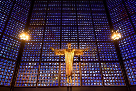 Crucifix in front of a glass facade