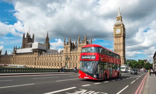 Red double-decker bus on the Westminster Bridge