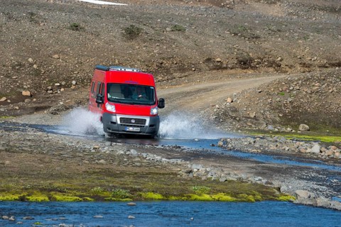 Caravan crossing river