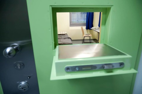 Looking through hatch in jail cell