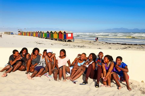 Happy black teenagers on the beach
