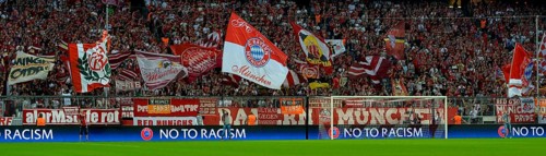 FC Bayern football fans holding flags