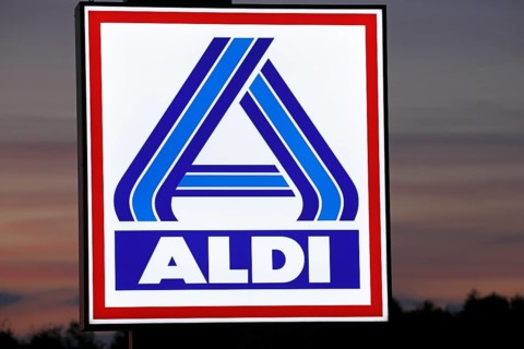 Illuminated company logo sign of the food discounter ALDI Nord