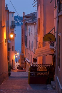 Steep narrow alley illuminated