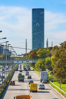 Road traffic at Georg-Brauchle-Ring with O2 tower