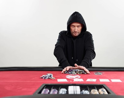 Man in hooded sweater going all-in