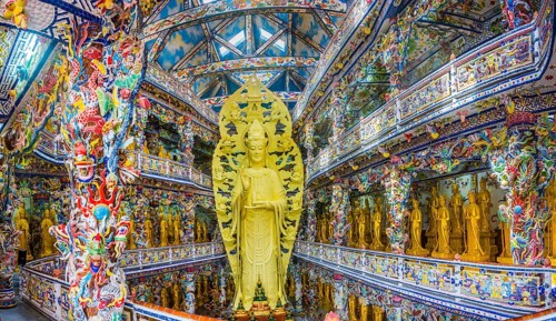 Giant golden standing Buddha