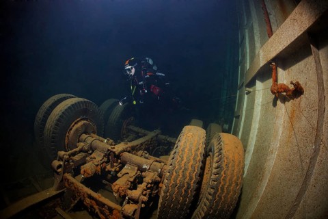 Diver looking at lorry in hold