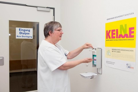 Doctor disinfecting hands against multiresistant bacteria