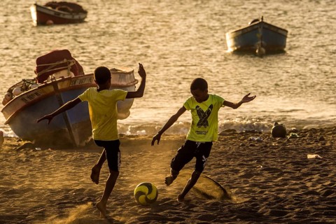 Teenager playing soccer