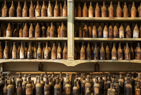 Showroom with old dust covered sherry bottles
