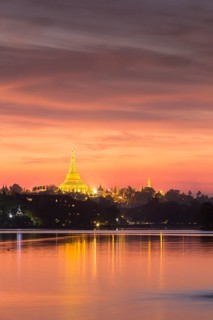 Illuminated Shwedagon Pagoda at sunset